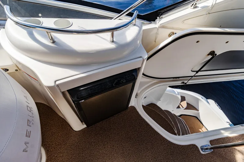 Slide: The Image of 2009 Meridian 391 Sedan yacht interior with stairs and compact fridge. - 17