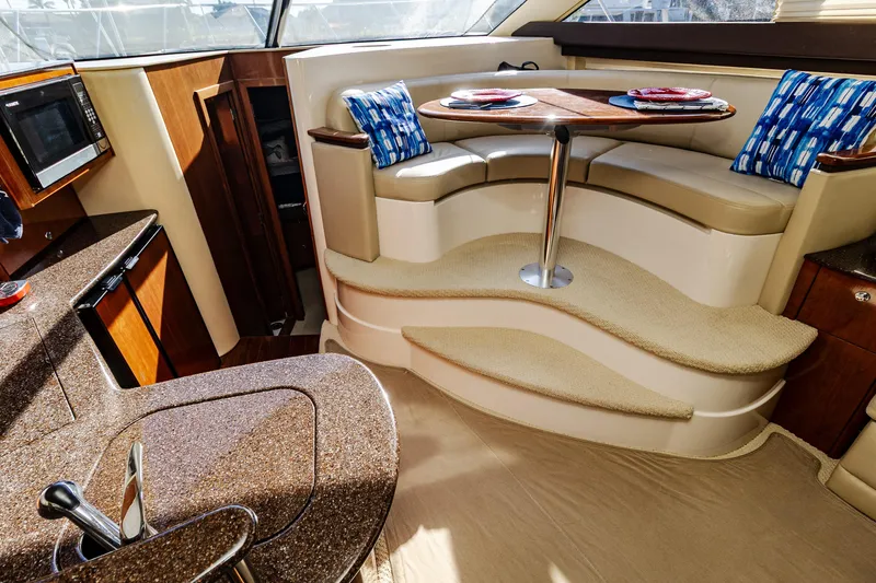 Slide: The Image of 2009 Meridian 391 Sedan interior with cozy dining area and modern kitchen amenities. - 20