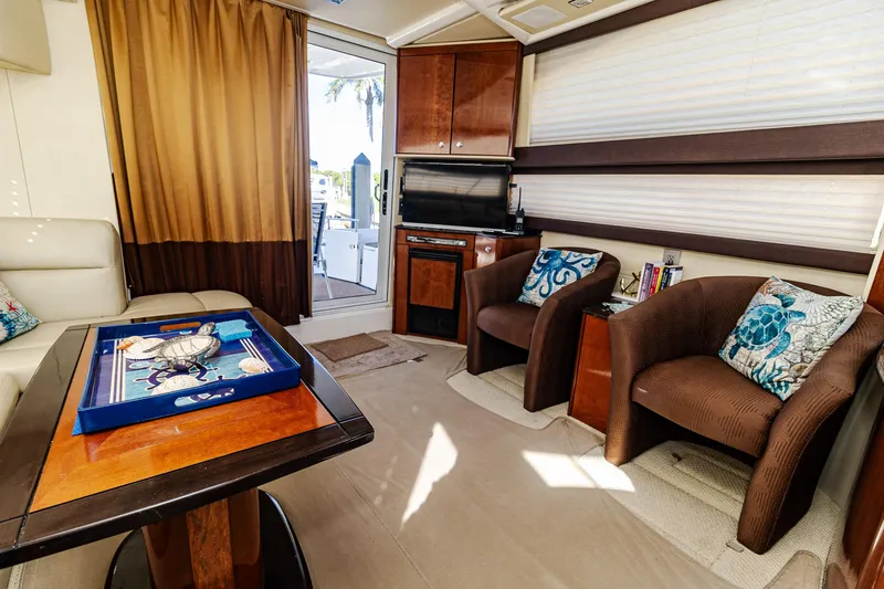 Slide: The Image of Interior of 2009 Meridian 391 Sedan yacht with cozy seating and nautical decor. - 26