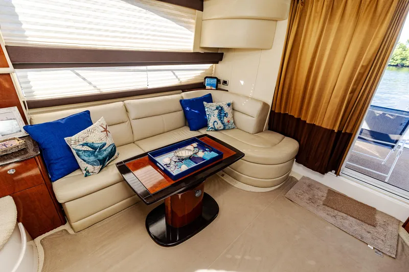 Slide: The Image of Luxurious interior of 2009 Meridian 391 Sedan yacht with plush seating and decorative pillows. - 29