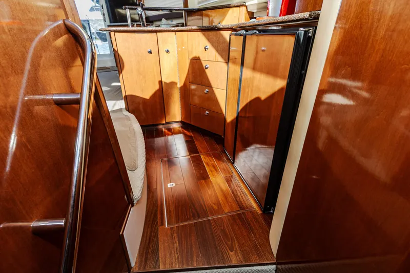 Slide: The Image of 2009 Meridian 391 Sedan interior with polished wood cabinetry and flooring. - 30