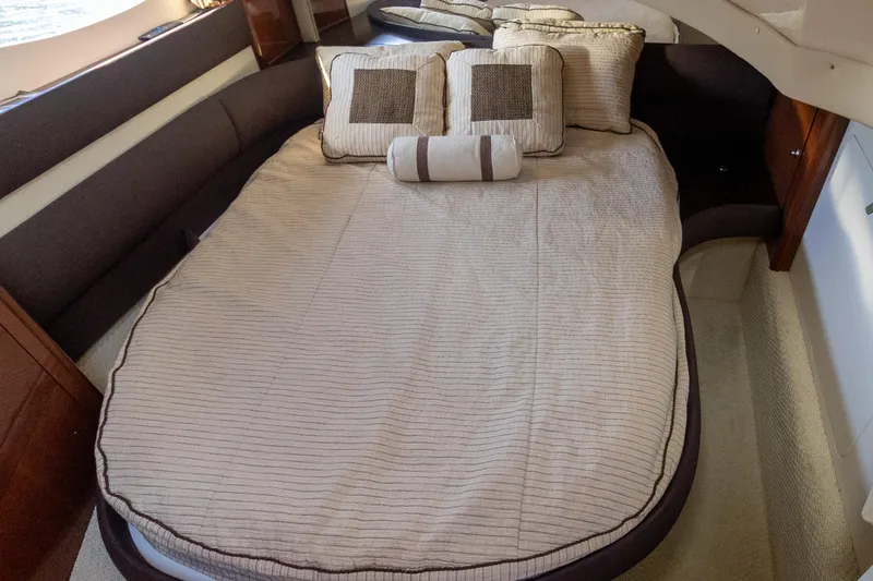 Slide: The Image of Luxurious 2009 Meridian 391 Sedan cabin with elegant bedding and plush pillows. - 31