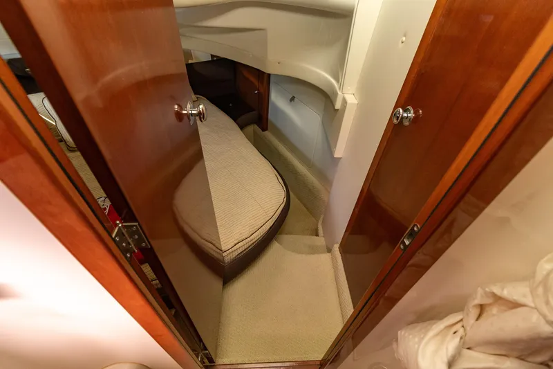 Slide: The Image of 2009 Meridian 391 Sedan cabin interior with cozy bed and wooden door. - 33