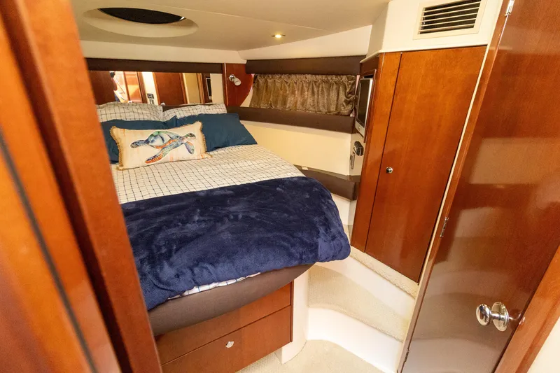 Slide: The Image of Luxurious 2009 Meridian 391 Sedan bedroom with cozy bedding and elegant wood finishes. - 38