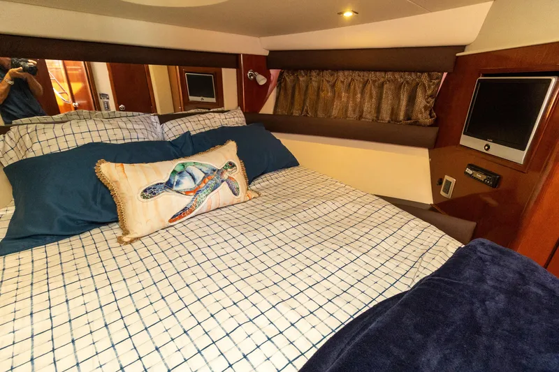 Slide: The Image of Luxurious 2009 Meridian 391 Sedan bedroom with cozy bedding and marine-themed decor. - 39