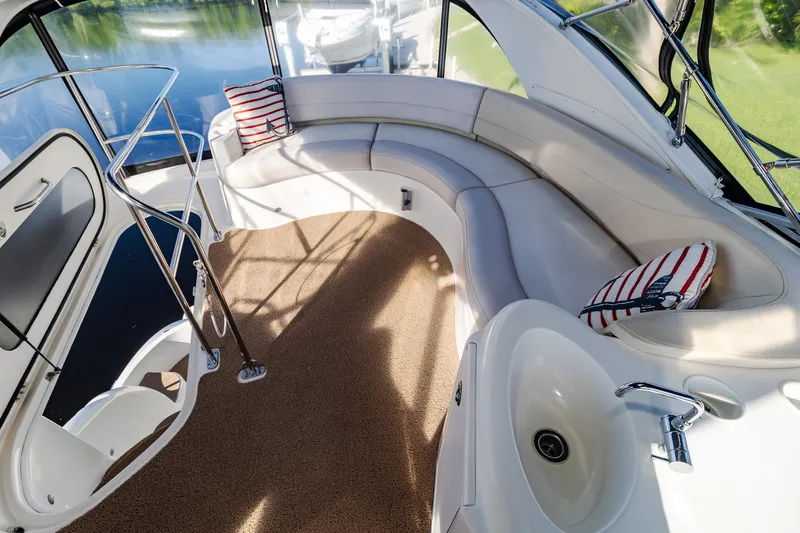 Slide: The Image of Luxurious 2009 Meridian 391 Sedan yacht interior with curved seating and scenic water view. - 9