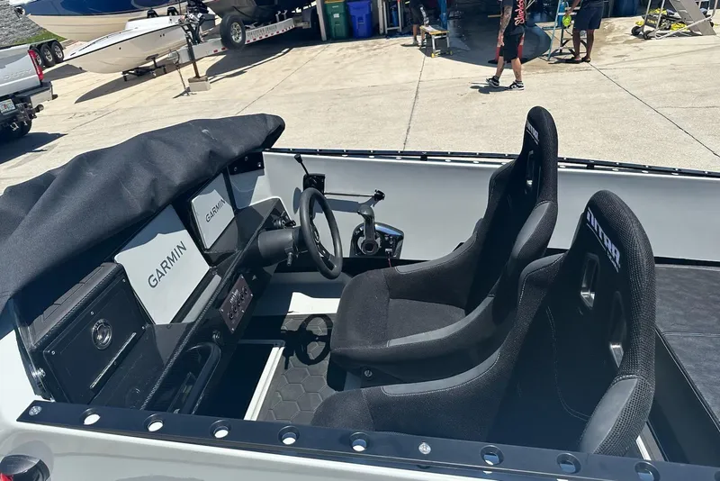 Slide: The Image of Interior of 2025 Nitra Boats 22 Supersport with Garmin displays and racing seats. - 3