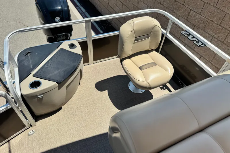 Slide: The Image of 2023 Sun Tracker SportFish 20 DLX boat interior with seating and storage. - 16