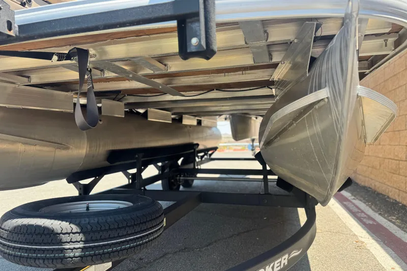 Slide: The Image of Underneath view of 2023 Sun Tracker SportFish 20 DLX pontoon boat on trailer. - 4