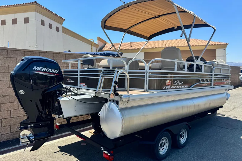 Slide: The Image of 2023 Sun Tracker SportFish 20 DLX pontoon boat with Mercury engine and canopy. - 6