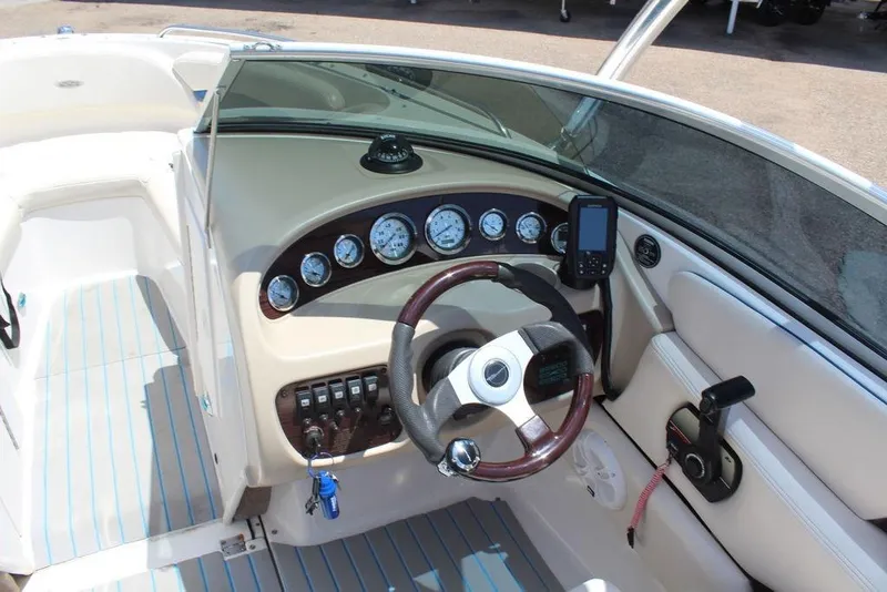 Slide: The Image of Interior view of a 2000 Chaparral 196 SSi boat dashboard with gauges and steering wheel. - 4