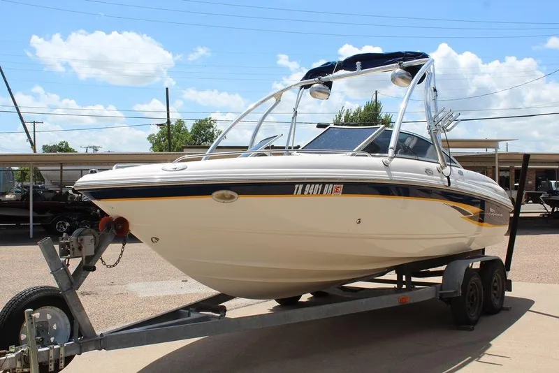 Slide: The Image of 2000 Chaparral 196 SSi boat on trailer under clear blue sky. - 8