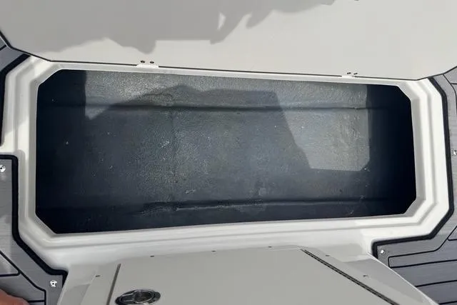 Slide: The Image of 2024 Starcraft SVX 191 OB storage compartment, open and empty, showcasing interior space. - 10