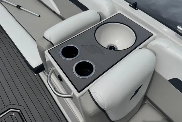 Slide: The Image of 2024 Starcraft SVX 191 OB boat interior with sink and cup holders. - 2