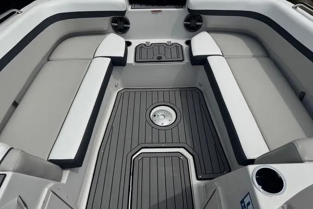 Slide: The Image of 2024 Starcraft SVX 191 OB boat interior with cushioned seating and sleek flooring. - 3