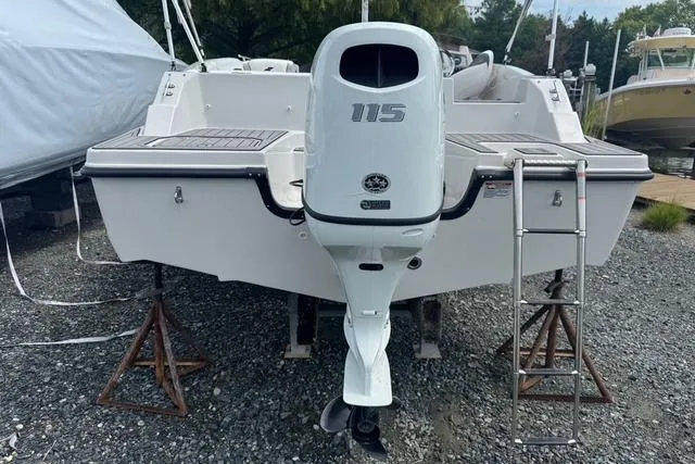 Slide: The Image of 2024 Starcraft SVX 191 OB boat with 115 HP outboard motor, rear view. - 4