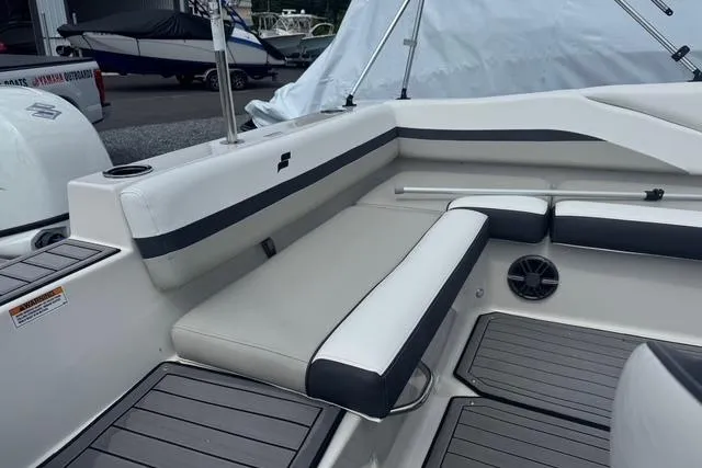 Slide: The Image of 2024 Starcraft SVX 191 OB boat interior with cushioned seating and sleek design. - 5