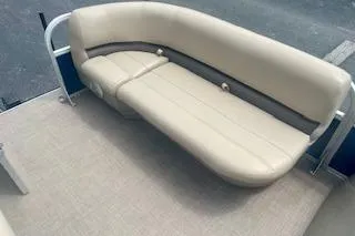 Slide: The Image of 2021 Sun Tracker Party Barge 18 DLX with beige seating on deck. - 11