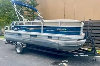 Slide: The Image of 2021 Sun Tracker Party Barge 18 DLX pontoon boat on trailer. - 12