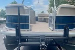 Slide: The Image of 2021 Sun Tracker Party Barge 18 DLX pontoon boat on trailer, ready for adventure. - 6