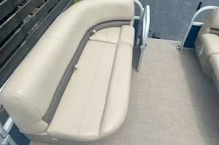 Slide: The Image of 2021 Sun Tracker Party Barge 18 DLX with beige seating and spacious deck. - 9