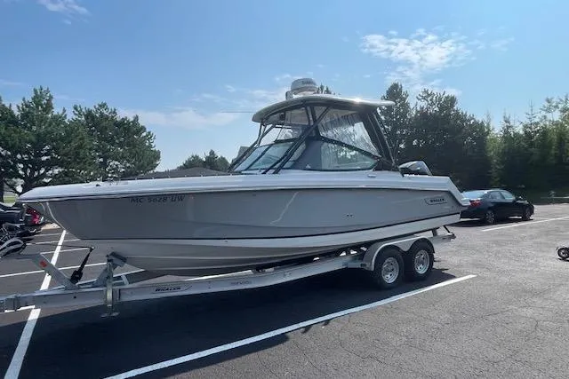 The Image of 2023 Boston Whaler 240 Vantage boat on trailer in parking lot. - 0