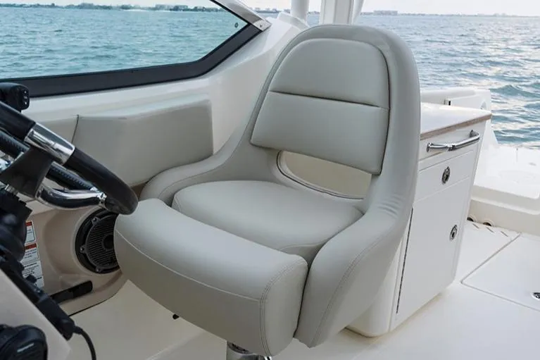 Slide: The Image of Manufacturer Provided Image: Captain's chair on 2023 Boston Whaler 240 Vantage boat, with ocean view. - 12