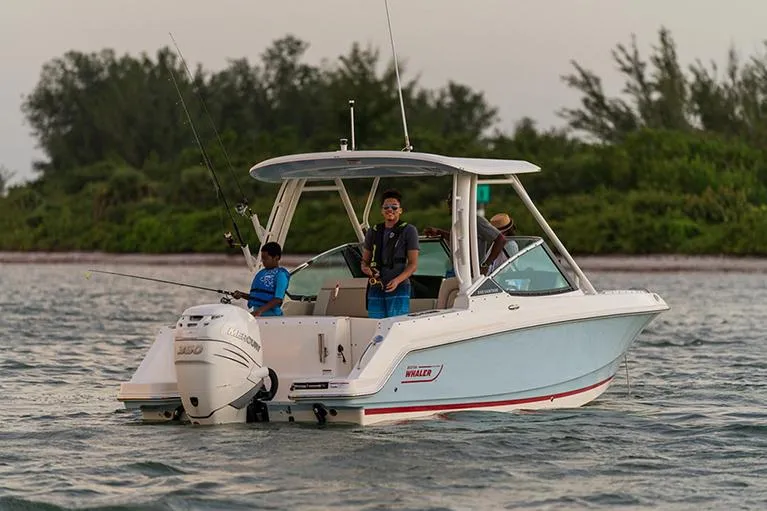 Slide: The Image of Manufacturer Provided Image: 2023 Boston Whaler 240 Vantage boat on water with people fishing. - 9