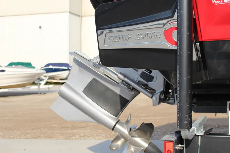 Slide: The Image of 2022 Chaparral 21 Surf boat with Surf Gate feature, rear view. - 13