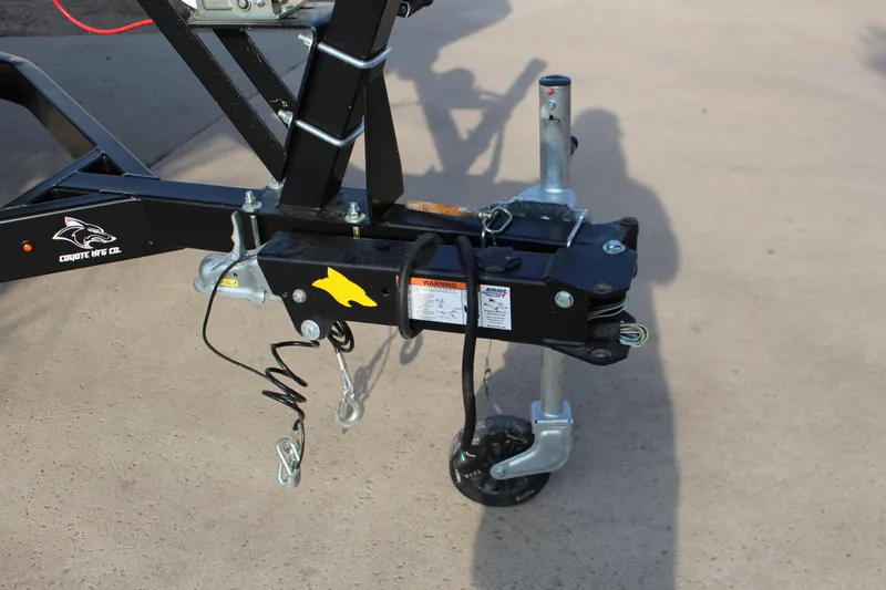 Slide: The Image of Trailer hitch of 2022 Chaparral 21 Surf boat, featuring Coyote MFG Co. branding. - 16