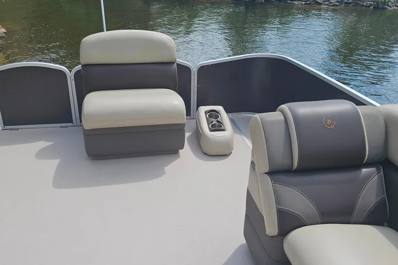 Slide: The Image of 2015 Premier 310 Escalante boat interior with comfortable seating and cup holders. - 13