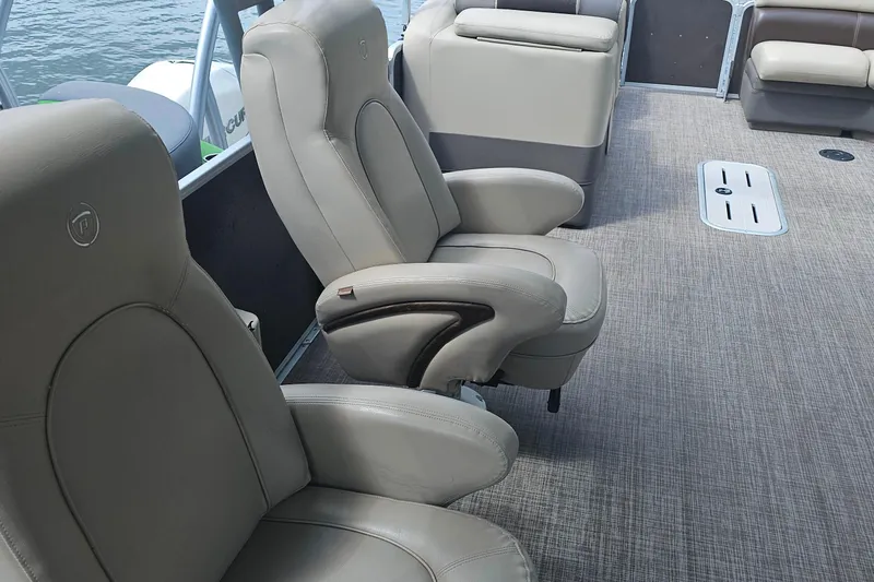 Slide: The Image of Premier 310 Escalante 2015 boat interior with plush seating and carpeted flooring. - 17