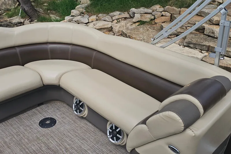 Slide: The Image of Luxurious seating on 2015 Premier 310 Escalante boat with beige and brown upholstery. - 22