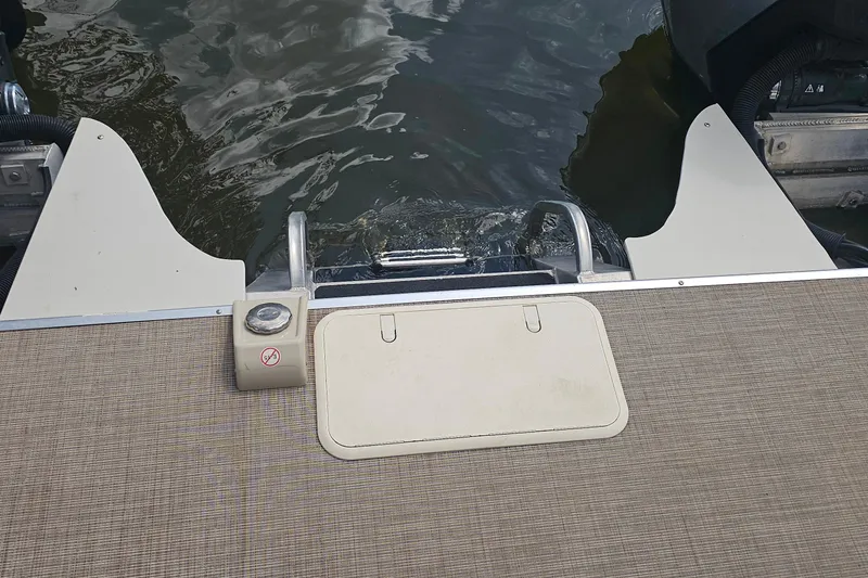 Slide: The Image of 2015 Premier 310 Escalante boat deck with water access and safety features. - 25