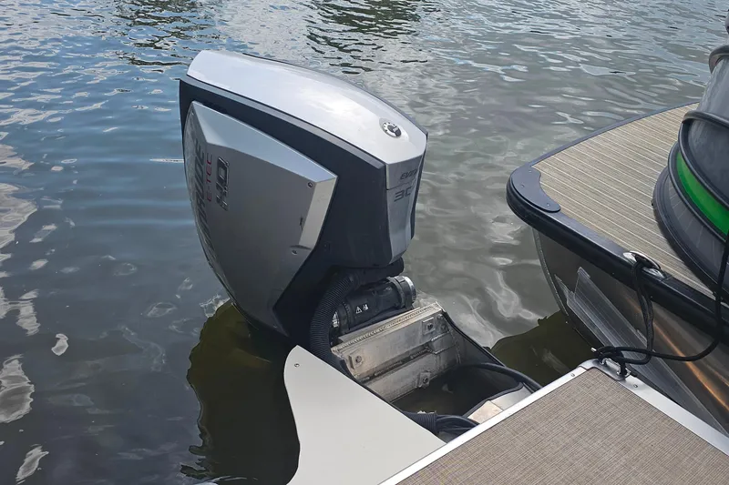 Slide: The Image of Outboard motor on 2015 Premier 310 Escalante pontoon boat in water. - 26