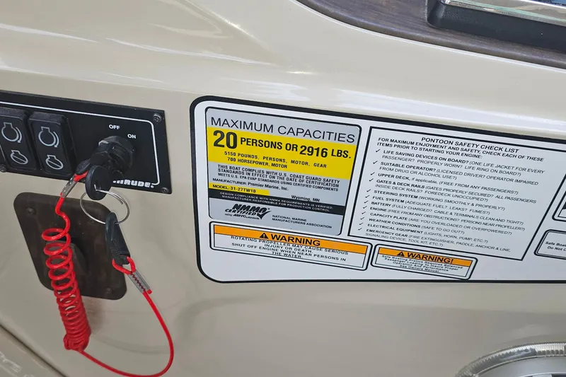 Slide: The Image of Control panel and safety label on 2015 Premier 310 Escalante pontoon boat. - 3