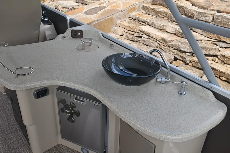 Slide: The Image of Luxurious 2015 Premier 310 Escalante boat kitchen with sleek countertop and modern sink. - 30