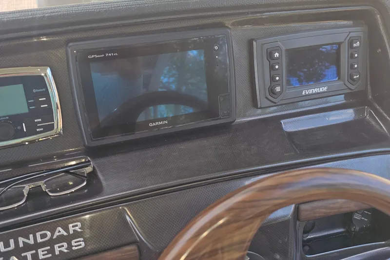 Slide: The Image of Dashboard of 2015 Premier 310 Escalante with Garmin and Evinrude displays. - 6