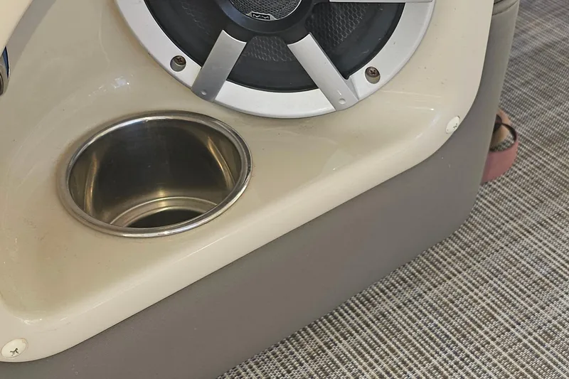 Slide: The Image of Speaker and cup holder in 2015 Premier 310 Escalante boat interior. - 7