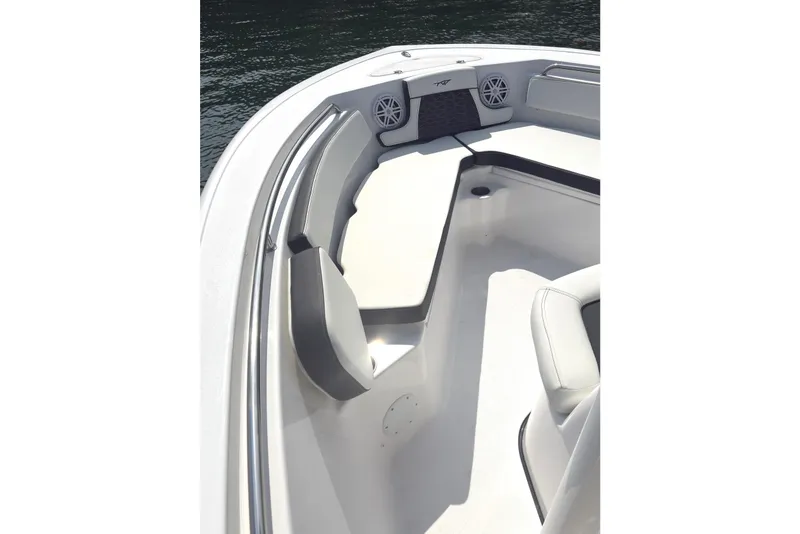 Slide: The Image of 2026 Tidewater 210 CC Adventure boat interior with cushioned seating and speakers. - 11