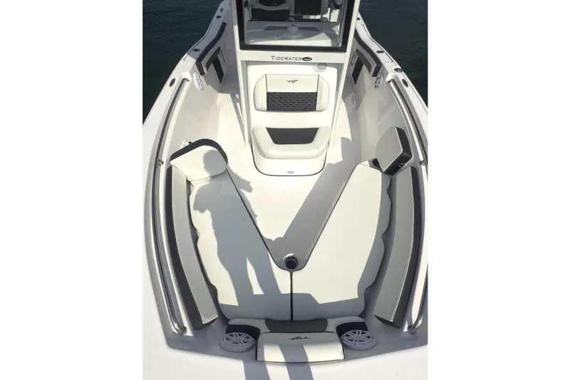 Slide: The Image of 2026 Tidewater 210 CC Adventure boat interior with seating and console. - 12