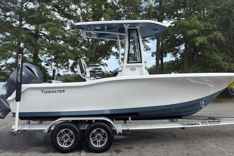 Slide: The Image of 2026 Tidewater 210 CC Adventure boat on trailer, parked outdoors. - 4