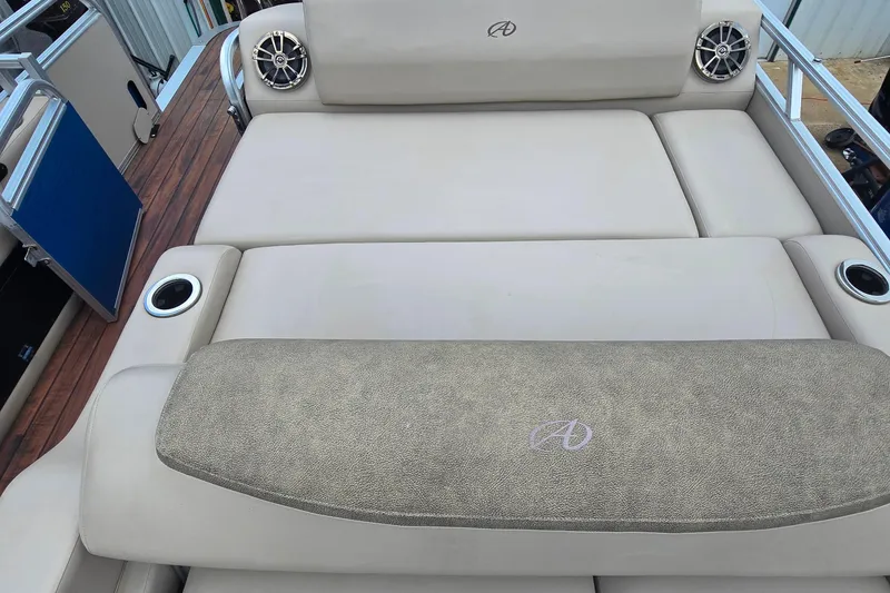 Slide: The Image of 2019 Avalon 2585 VRL boat interior with beige seating and cup holders. - 4