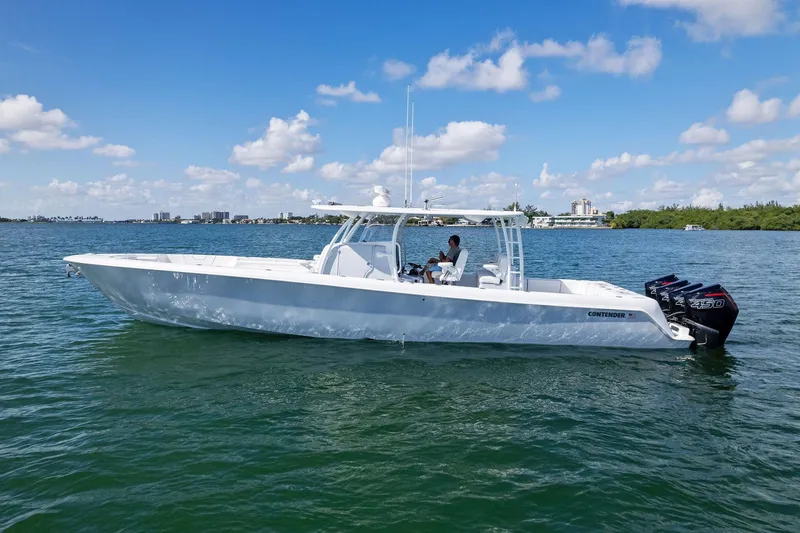 Slide: The Image of 2026 Contender 44 Fisharound boat cruising on a sunny day with clear skies. - 18