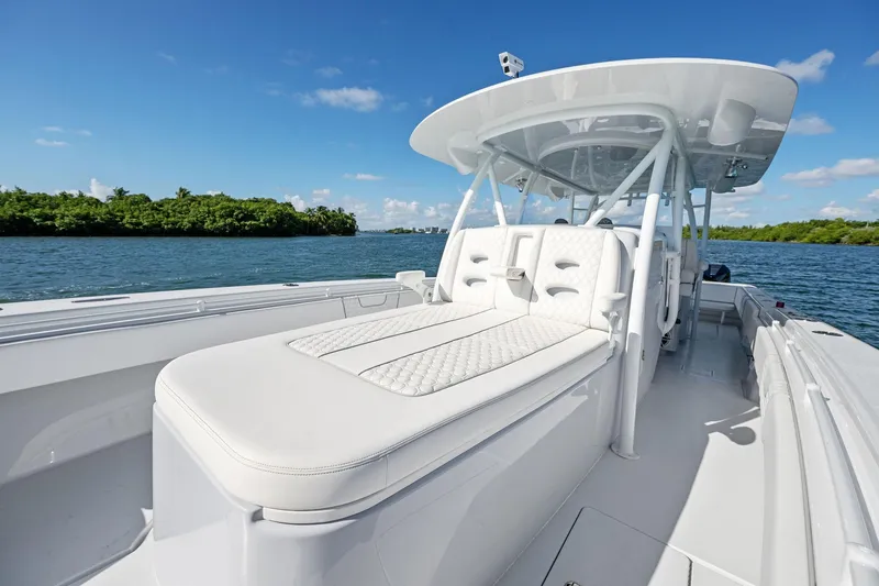 Slide: The Image of 2026 Contender 44 Fisharound boat with luxurious seating on a sunny day. - 20