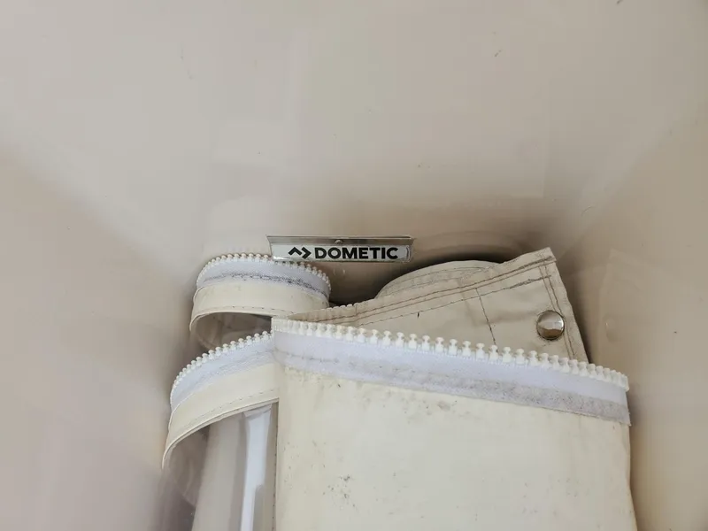 Slide: The Image of 2018 Grady-White Express 330 boat deck with cup holders and storage compartments. - 19