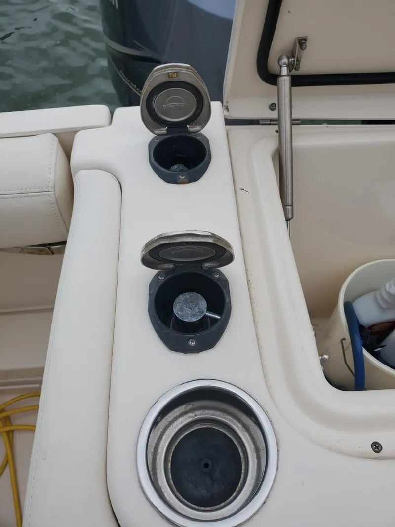 Slide: The Image of 2018 Grady-White Express 330 boat transom door, white upholstery, dockside view. - 21