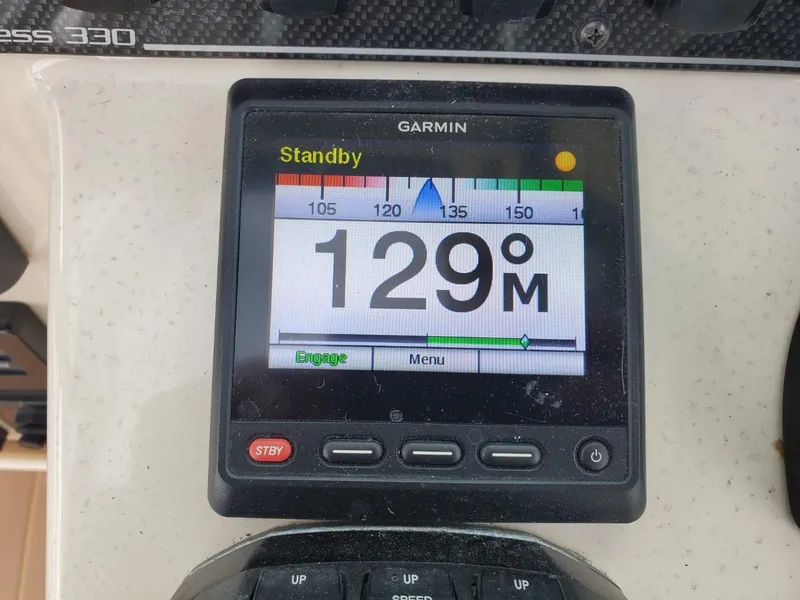 Slide: The Image of Control panel of a 2018 Grady-White Express 330 boat with Garmin devices. - 25