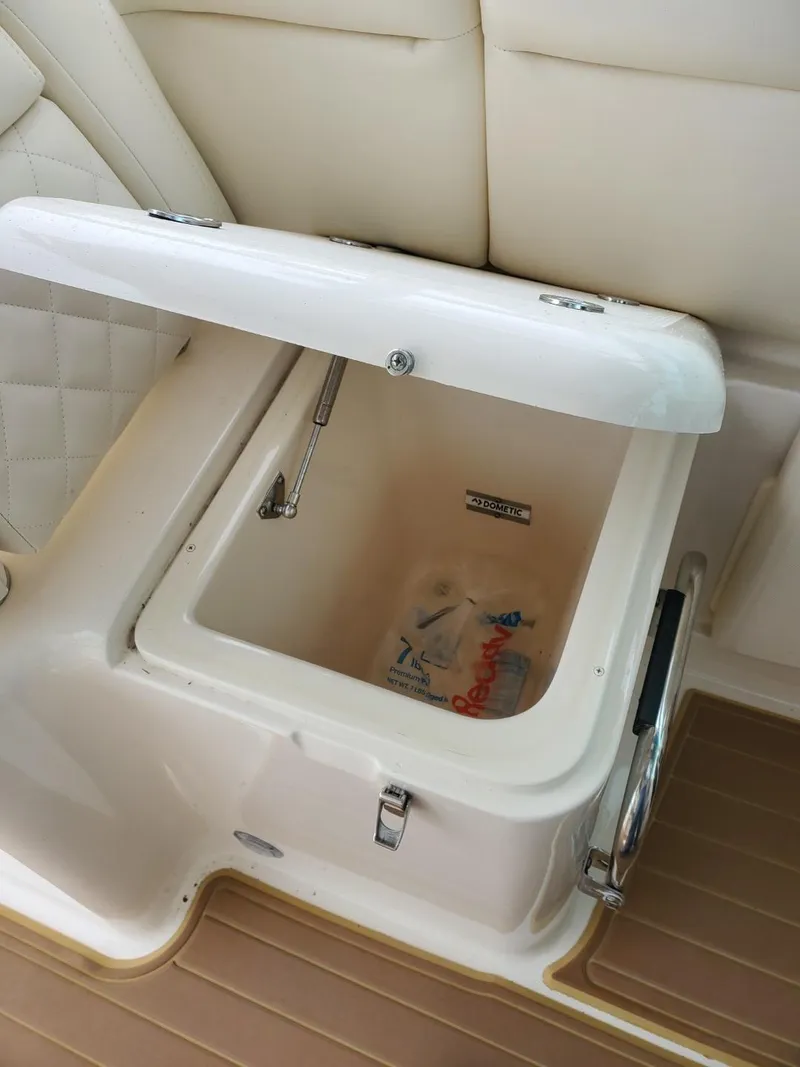 Slide: The Image of 2018 Grady-White Express 330 interior detail with vent, cup holder, and storage net. - 31