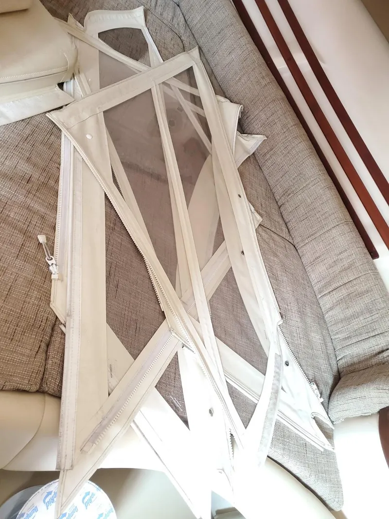 Slide: The Image of 2018 Grady-White Express 330 boat kitchen with stove, microwave, and wooden cabinetry. - 39